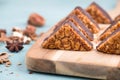 Nut corner, traditional german sweets called Nussecke, covered with chocolate Royalty Free Stock Photo