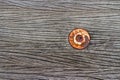 The nut is rust on old wood floor Royalty Free Stock Photo