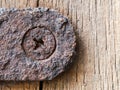 Nut and rusted iron stuck on wood Royalty Free Stock Photo