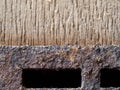 Nut and rusted iron stuck on wood. Royalty Free Stock Photo