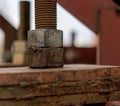 The nut is screwed onto the bolt. Fastening a large bridge Royalty Free Stock Photo