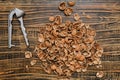 Nut shells and a nutcracker scattered on a wooden surface after a snack time Royalty Free Stock Photo