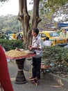 The nut shop man is selling nuts