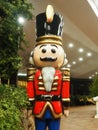 Nutcracker in festive New Year's Christmas style. Red gold wooden toy. Nutcracker Christmas soldier. Fairy tale