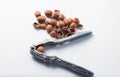 Nutcracker and hazelnuts on a white background Royalty Free Stock Photo