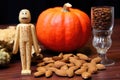 nutcracker next to raw, unshelled pumpkin seeds