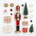 Nutcracker set with Christmas items around isolated on white Royalty Free Stock Photo