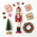 Nutcracker set with Christmas items around isolated on white Royalty Free Stock Photo