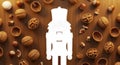 Nutcracker Silhouette Surrounded by Walnuts and Hazelnuts on Wooden Background Royalty Free Stock Photo