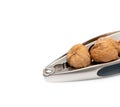 nutcracker and walnuts on white Royalty Free Stock Photo
