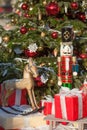 Nutcracker and wood horse at Christmas Market  in Winter Moscow, Russia. Advent Decoration and fir tree with Crafts gifts on the Royalty Free Stock Photo