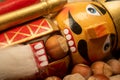 Nutcracker wooden figure of a soldier for cracking nuts on the background of scattered nuts. Traditional symbol of Christmas and Royalty Free Stock Photo