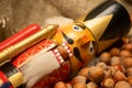 Nutcracker wooden figure of a soldier for cracking nuts on the background of scattered nuts. Traditional symbol of Christmas and Royalty Free Stock Photo