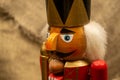 Nutcracker wooden figure of a soldier for cracking nuts. Traditional symbol of Christmas and New Year. Close up