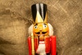 Nutcracker wooden figure of a soldier for cracking nuts. Traditional symbol of Christmas and New Year. Close up