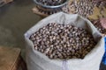 Nutmeg beans in burlap sack. Whole beans packed in bulk bags. Raw beans. Bulk beans