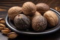 Nutmeg in Black Plate, Myristica Fragrans Fruit, Dry Spicy Nutmeg, Grated Whole Muscat Nut, Nut Meg