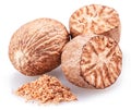 Nutmeg and ground nutmeg heap isolated on white background Royalty Free Stock Photo