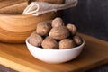 Nutmeg macro in a bowl. Nutmeg powder. Nutmeg spice.