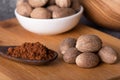 Nutmeg macro in a bowl. Nutmeg powder. Nutmeg spice.