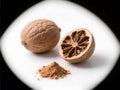 Close-Up of Nutmeg, Whole and Ground, on White Background Royalty Free Stock Photo