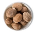 Nutmegs in plate isolated Royalty Free Stock Photo