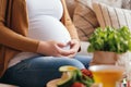 Nutrient delight Pregnant woman enjoys healthy food for baby