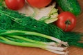 Nutrients are ideal for a delicious salad of fresh vegetables on a wooden board Royalty Free Stock Photo