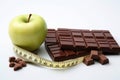 Nutrition choice Apple, measuring tape, chocolate on white background Royalty Free Stock Photo