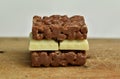 Chocolate crispies sweets and white chocolate forming a chocolate sandwich