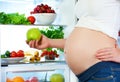 Nutrition and diet during pregnancy. Pregnant woman with fruits Royalty Free Stock Photo