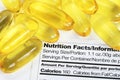 Nutrition label with fish oil pills Royalty Free Stock Photo