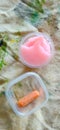 Child snack, made of pink jelly and a tiny dried carrot.