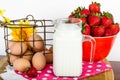 Nutritional breakfast of brown eggs, strawberries and milk