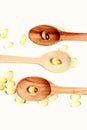 Nutritional supplements and healthy lifestyle concept. Natural medicines and wooden spoons. Omega 3 pills and cooking