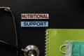 Nutritional Support on top view black table and Healthcare/medical concept