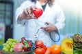 Nutritionist doctor holding red heart Royalty Free Stock Photo