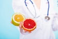 Nutritionist holding some fruits in her hand Royalty Free Stock Photo