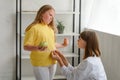 Nutritionist measuring obese girl's waist. Childhood obesity and weight loss Royalty Free Stock Photo