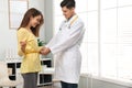 Nutritionist measuring young patient`s waist Royalty Free Stock Photo