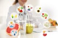 Nutritionist`s recommendations. Doctor with healthy products at table