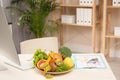 Nutritionist`s workplace with fruits, vegetables, measuring tape and body fat calipers