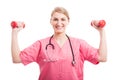 Nutritionist woman holding up training weights Royalty Free Stock Photo