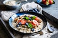 Bircher muesli with strawberries, blueberries, chia seeds, walnuts, sunflower seeds and pumpkin seeds Royalty Free Stock Photo