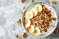 Healthy Breakfast Bowl With Greek Yogurt, Sliced Bananas, and Granola