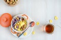 Nutritious breakfast on white wooden background