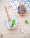 Nutritious chia seeds museli and peppermint leaves with wooden Royalty Free Stock Photo