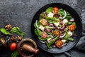 Nutritious simple salad with chard, walnuts, soft cheese, onions and oil