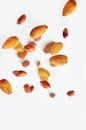 Nuts in the air on a white background, flying nuts. Healthy Brain Food, Diet, Protein, Almonds, walnuts and hazelnuts Royalty Free Stock Photo