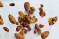 Nuts in the air on a white background, flying nuts. Healthy Brain Food, Diet, Protein, Almonds, walnuts and hazelnuts Royalty Free Stock Photo